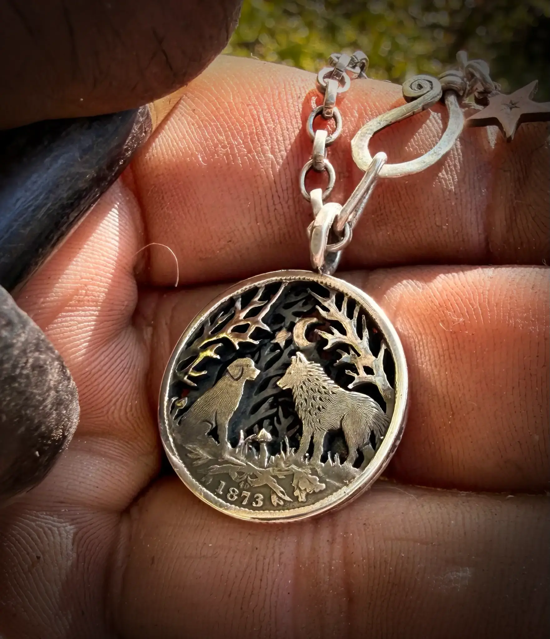 the dimpsey time. A dimply necklace pendant made from upcucled silver shilling coins in Cambridge England