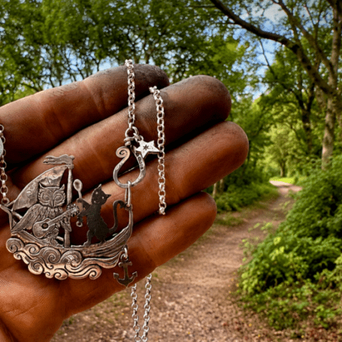 the owl and the pussycat necklace completely handcrafted in Cambridge using only upcycled silver coins of a bygone era
